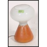 A 1960's glass two tone retro mushroom lamp in orange and white in the manner of John Ditchfield.