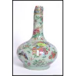 A 19th century Chinese famille rose celedon ground vase decorated with  birds of paradise,