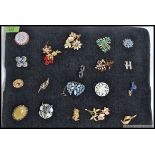 A good collection of 20 vintage costume jewellery dress broaches to include flower broaches ,