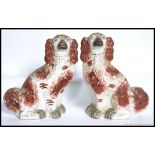 A pair of large 19th / 20th  century Staffordshire pottery fireside dogs,