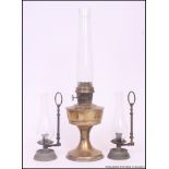 An early 20th century Super Aladdin brass oil lamp with flue.
