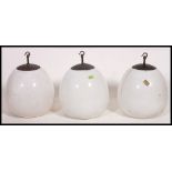 A stunning set of 3 mid century Industrial bulbous white opalescent
glass ceiling lights with