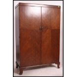 A good quality 1930's oak compactom wardrobe.