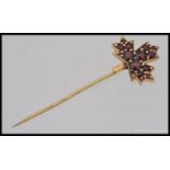 A 22ct / 900 marked hi - carat gold and ruby hat - stick pin.