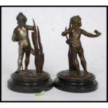 A pair of late 19th / early 20th century spelter bronzed figures on a marble base.