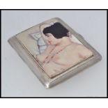 A silver and enamel cigarette case / calling card case with pictorial image to front of a nude. L8.