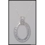 A 925 pendant necklace with large oval CZ Halo pendant with Buguette and round cut CZ.