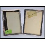 A pair of matching silver oak backed easel hallmarked picture frames,