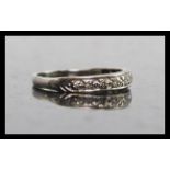 An 18ct white gold  and diamond half eternity ring. The ring with channel set stones approx 10pnts.