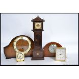A 1940's mantel clock together with a miniature grandfather clock, Swiza alarm clock,