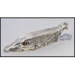 A large silver plated clip in the form of a fish with inset glass eyes.