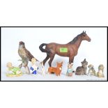 A collection of ceramic figurines to include a Royal Worcester  ' Michael ' by FG Doughty,