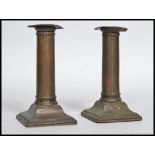 2 Georgian 19th century silver plated copper candlesticks.