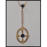 An Art Nouveau 9ct gold Sapphire and seed pearl pendant and necklace chain.