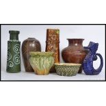 A collection of vases to include West German, Denby,