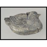 A silver plated vesta case in the form of a bird.