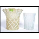 Two vintage early to mid century glass oil lamp shades to include a two tone fluted shade with a