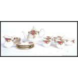 A collection of Royal Albert Country Roses bone china, to include a teapot,
