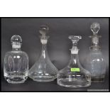 4 glass decanters, circa 20th century to include 2 ships decanters, all with stoppers.