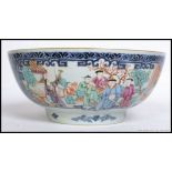 A 19th century Chinese bowl, having hand painted court scene panels,