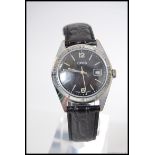 A 1960's gentlemans vintage Oris black face wristwatch.