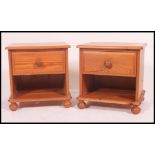 A good quality contemporary pine pair of bedside cabinets having single drawers with knob handles