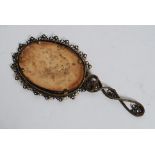 A vintage mid century gilt metal rococo ladies hand mirror.