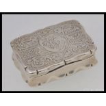 A good sized silver hallmarked stamp box being of casket / book form with rococo chased decoration,