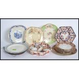 A collection of Victorian and later period plated along with ceramic ladles and a plate warmer.