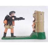 MONEY BOX: A 20th century reproduction shooting themed cast iron painted money box.