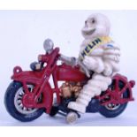 MICHELIN MAN: A vintage style cast iron Michelin Man and motorcycle figure. Hand painted.