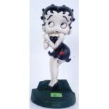 BETTY BOOP: A contemporary cast iron door stop, hand painted, in the form of cartoon Betty Boop.