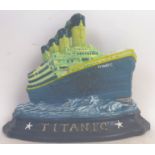 TITANIC: A good heavy cast iron doorstop, in the form of the Titanic, hand painted,