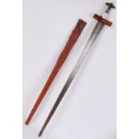A 19th century Sudanese Kaskara sword with leather bound grip, cruciform crossguard,