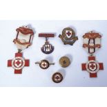 A collection of enamel set British Red Cross Society medals - Proficiency in Red Cross First Aid.