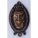 A silver hallmarked military naval medal  with anchor and lobster motif.