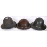 HELMETS: A collection of 3x WWII Second World War tin helmets, British.