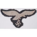 A Third Reich / Nazi second world war WWII era Luftwaffe tunic eagle uniform cloth patch.