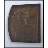 A bronze plaque cast in relief and struc