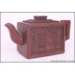 A Chinese terracotta Yi-Xing teapot. The