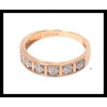 A 9ct gold and diamond half eternity rin