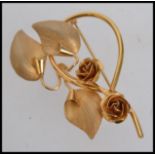 A vintage rolled gold flower spray brooc