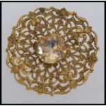 Large vintage yellow metal brooch with c
