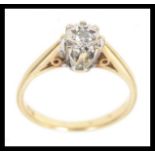 A 9ct gold diamond solitaire ring set wi