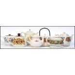 A collection of teapots to include a matching biscuit barrel makers to inc New Hall, Kensington,