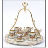 A Capodimonte large tea service set on a large decorative ceramic tray with handle having cherub