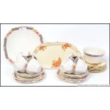 A vintage chintzy floral tea service by Alfred Meakin,