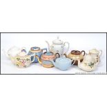 A collection of teapots to include 3 Victorian lustre examples, also Johnson Bros, Sadler,