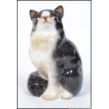 An Royal Doulton figure of a sitting cat ' Sitting Cat ',stamped to base with Doulton mark HN 999.