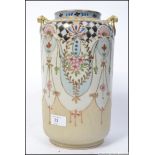 A decorative large 20th century Noritake Japanese vase having gilded twin handles with gilded swag